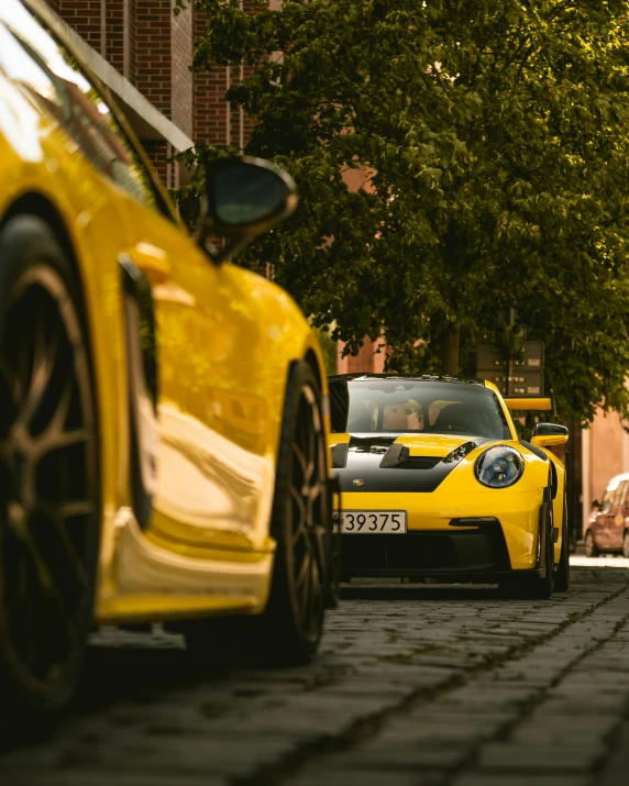 cars are parked along a curb with trees