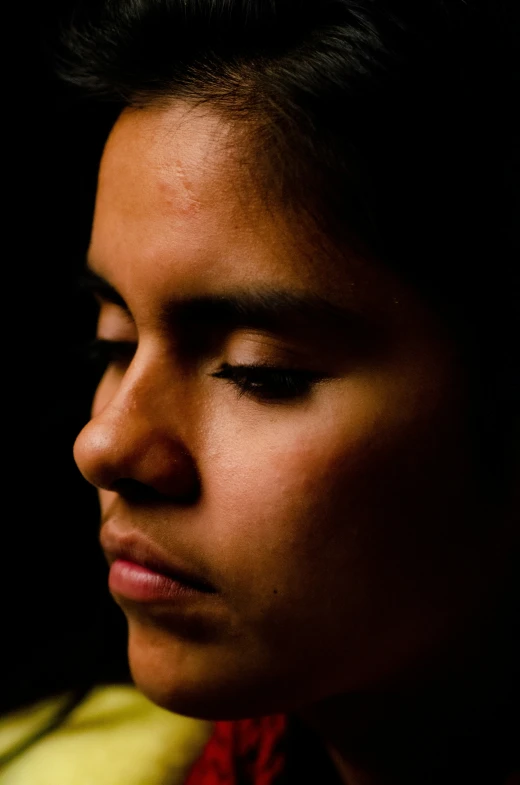 an image of a girl looking down on her head