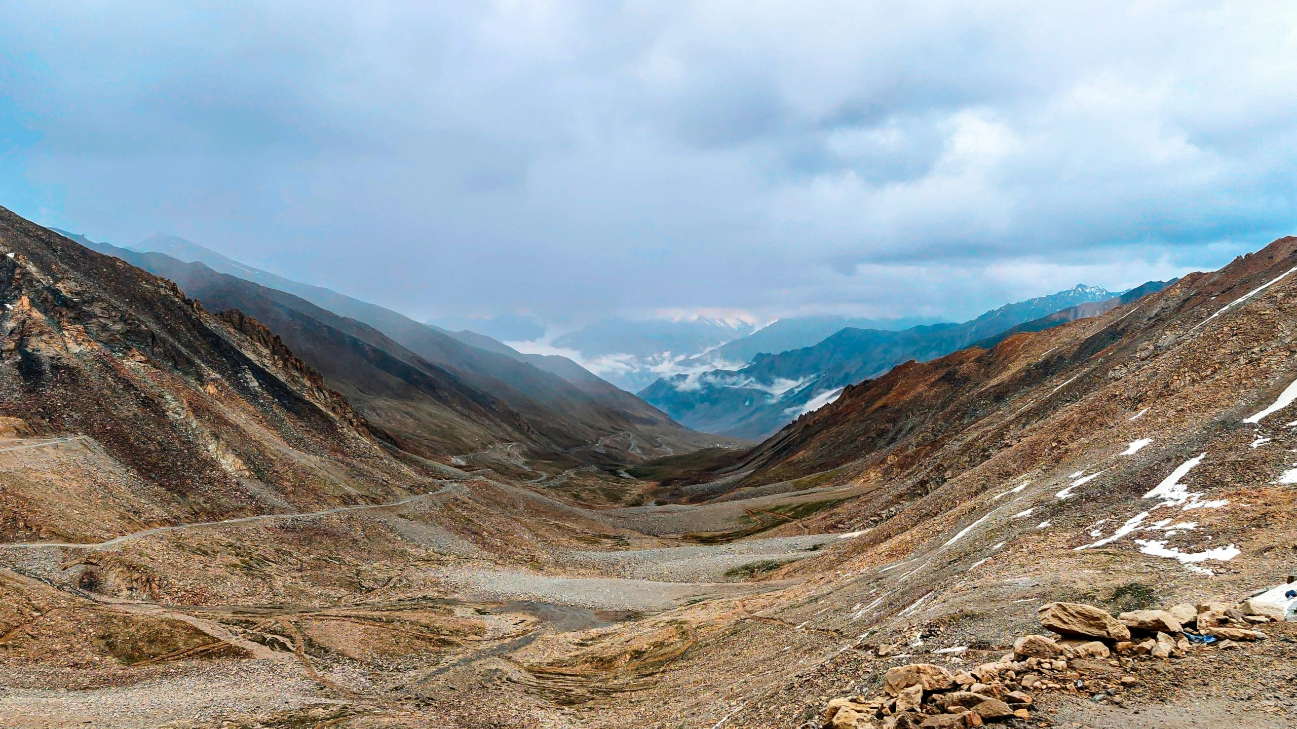 mountains that have snow covered rocks on them