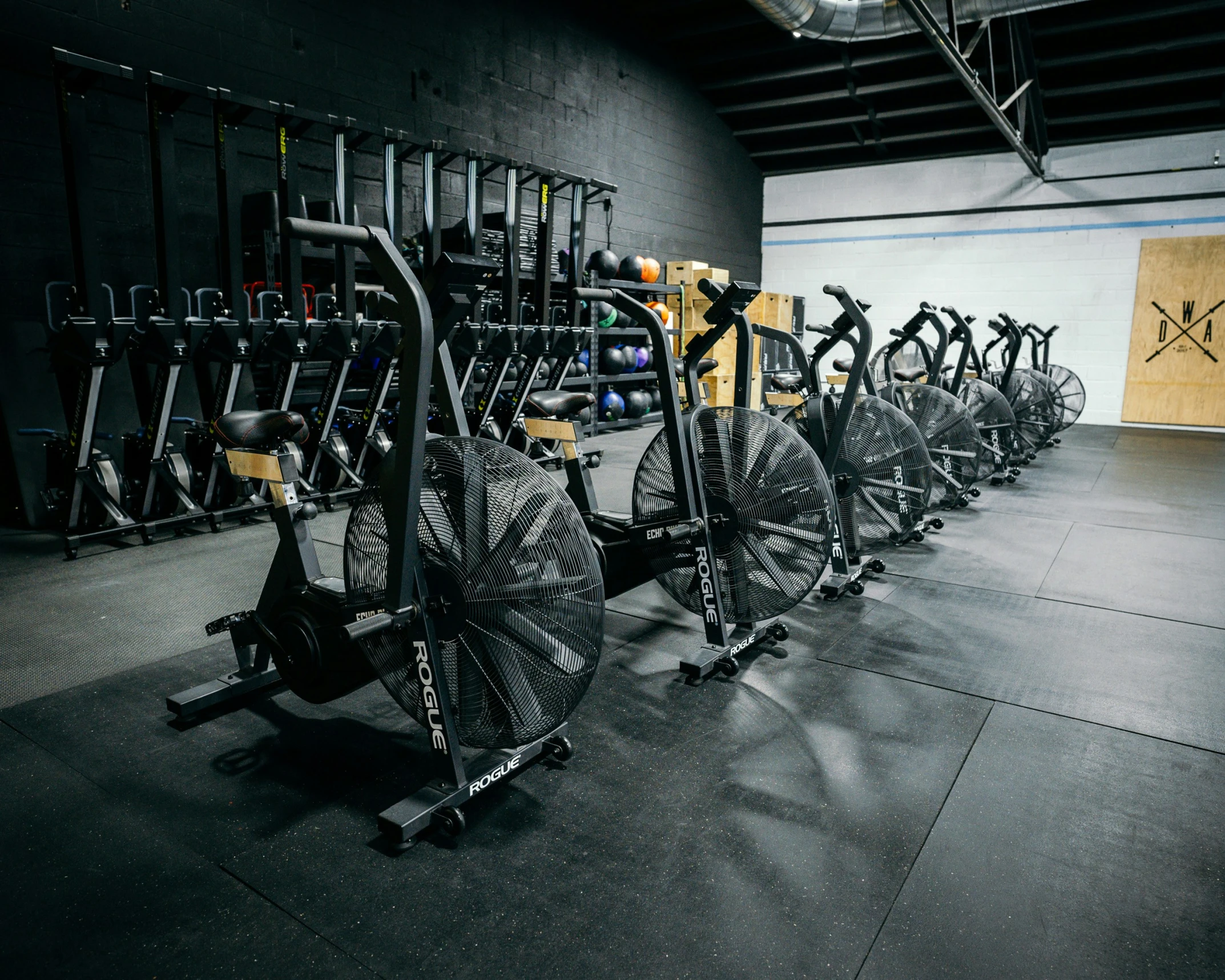 the bicycles are lined up by the bike racks