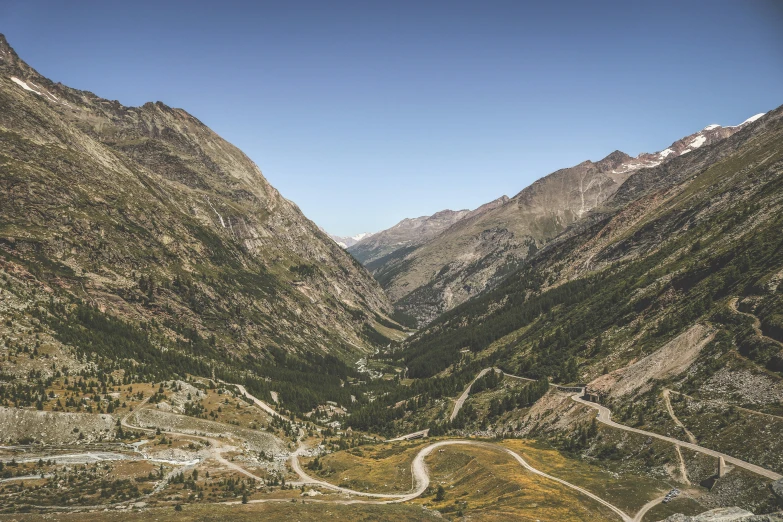 the road is going down the mountain pass