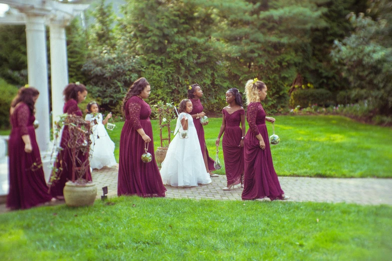 brides walk down the path at an outdoor ceremony