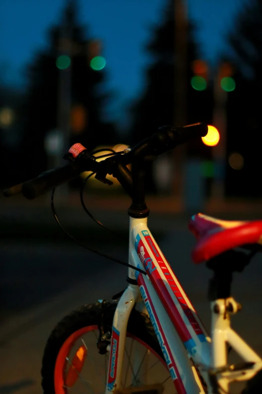 the bike is parked on the side of the street