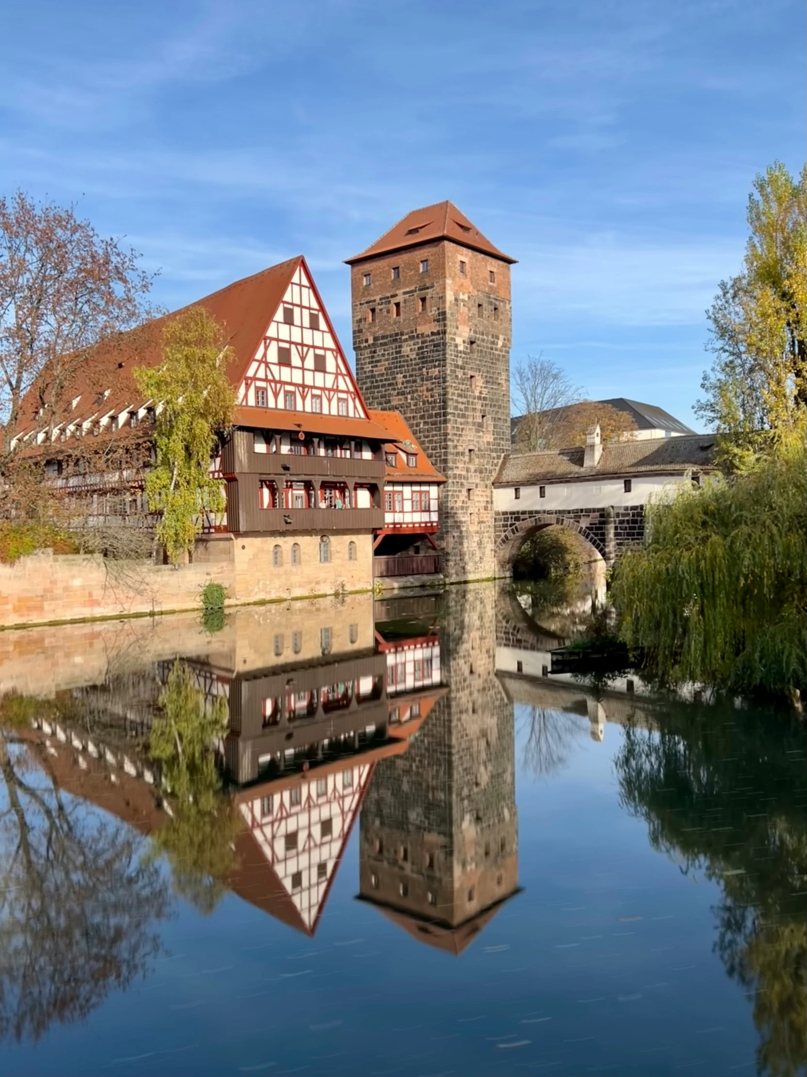 a building next to some water and buildings