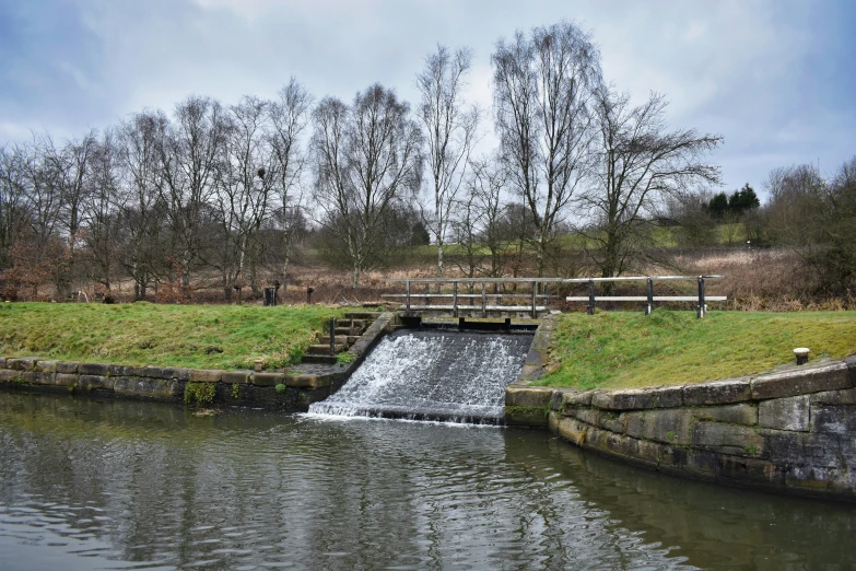 a small waterfall coming out of a river