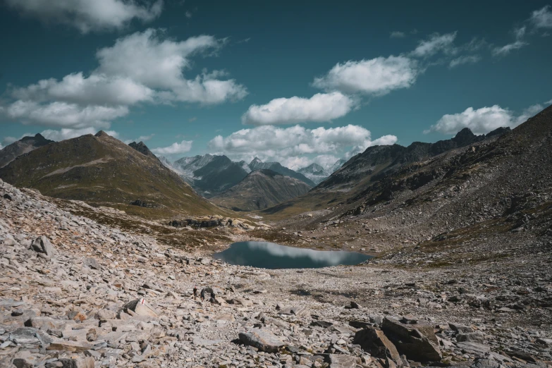 the mountains are seen behind the clear water