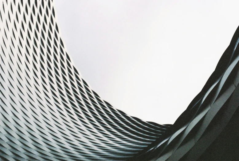 looking up at a structure with wavy patterns