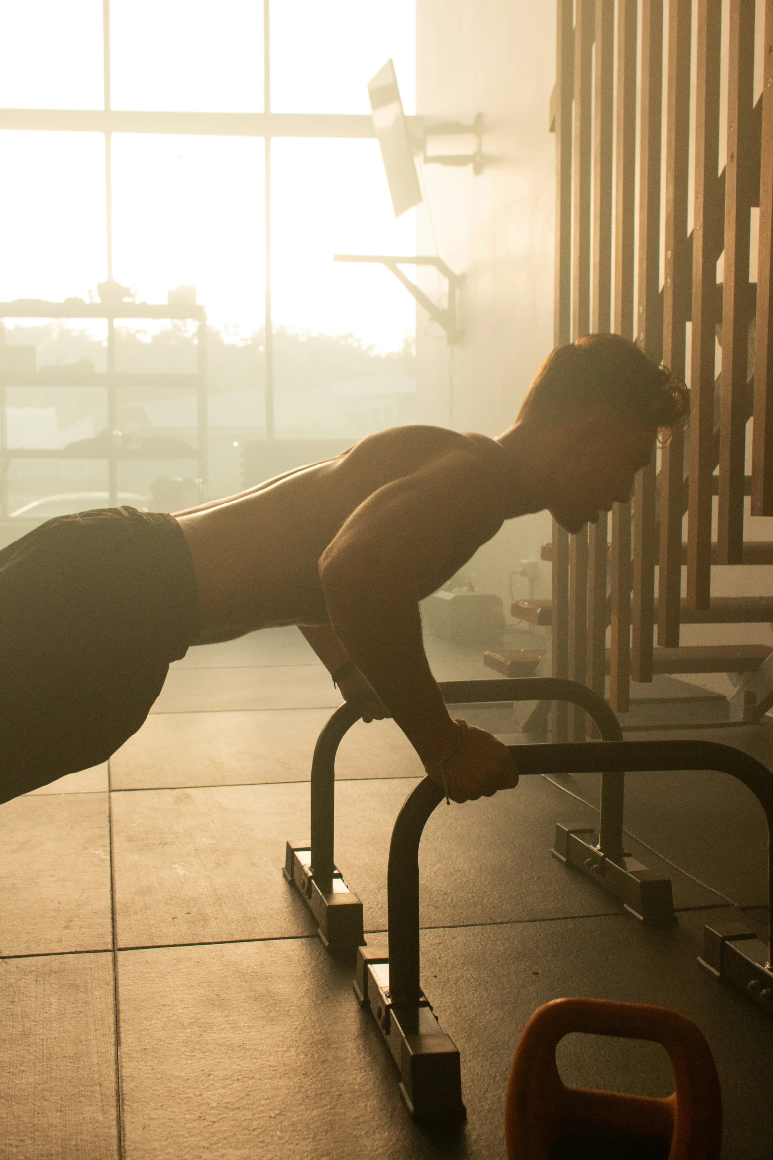 a man working out on a bench using a rowing machine