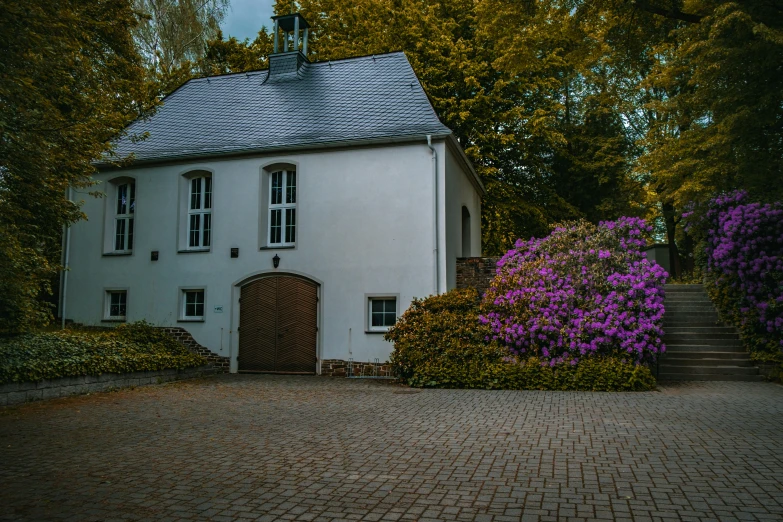 a house with flowers all around it