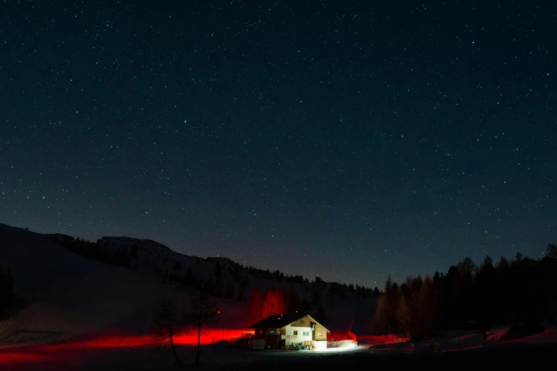 the night sky filled with stars and glowing houses