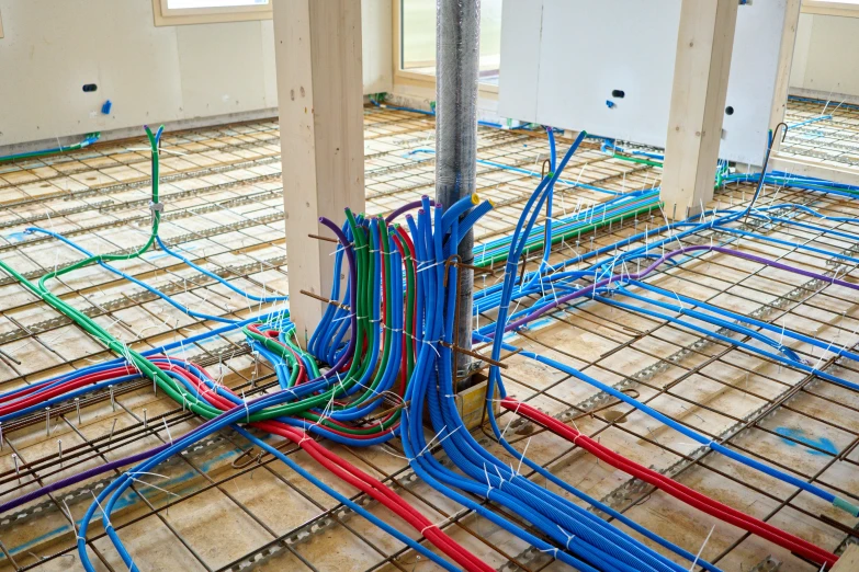 a long and thin, empty floor with many wires exposed