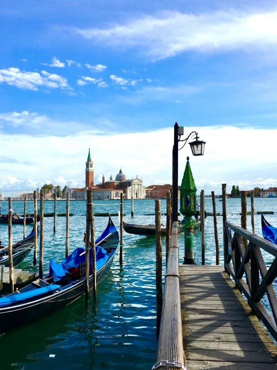 the pier is empty with gondolas on it