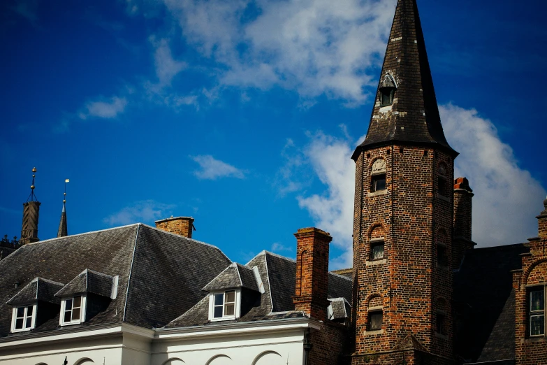 a tall brick building with a clock on top of it