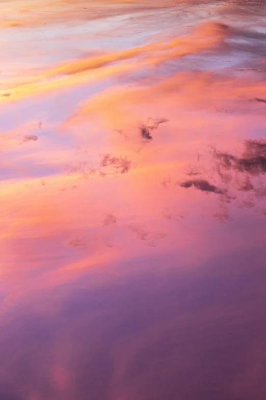 a beautiful sky filled with clouds over the ocean