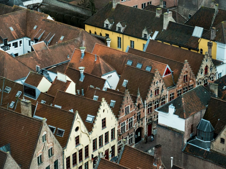 the tops of several buildings with the roofs exposed