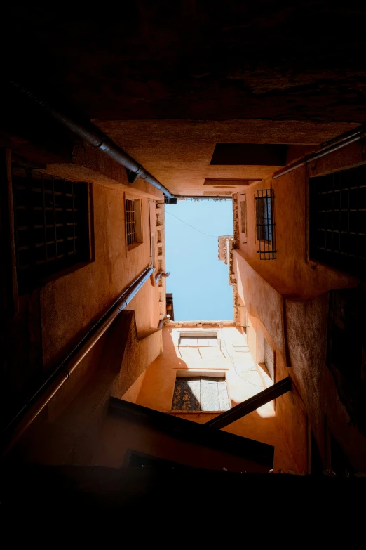 the view from the bottom of an indoor stair case