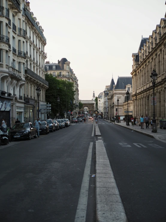 the street in front of some buildings is empty