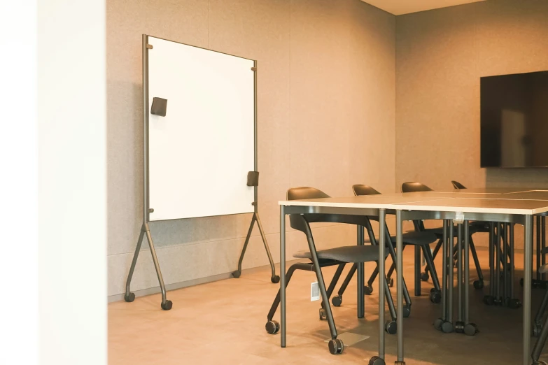 a large board sits in the corner of a conference room