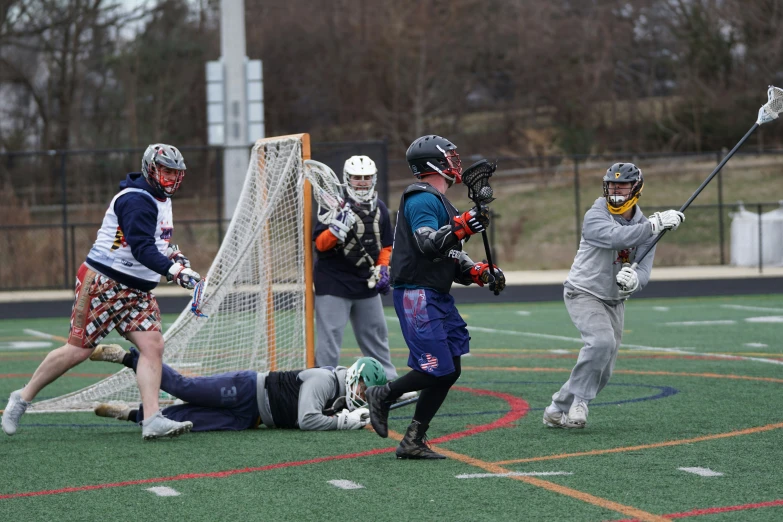 a group of people playing a game of lacrosse