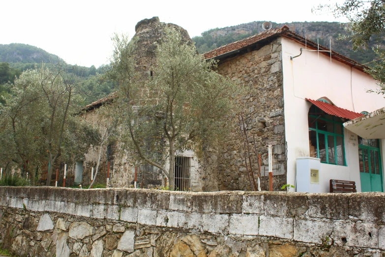 an old house with vines growing on the side