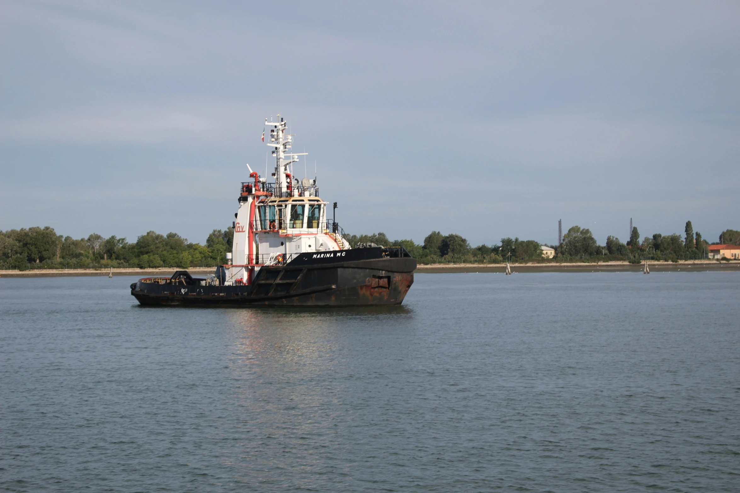 a boat on the water in a large body of water