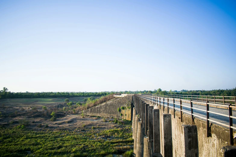 a bridge that has some very tall poles on it