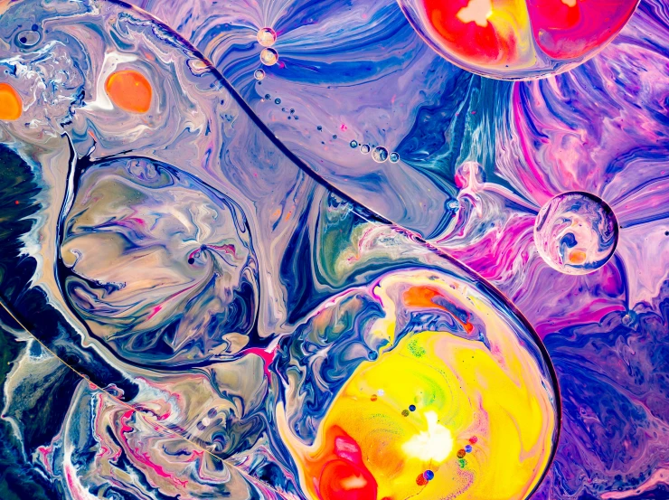 colorful oil bubbles floating together in water