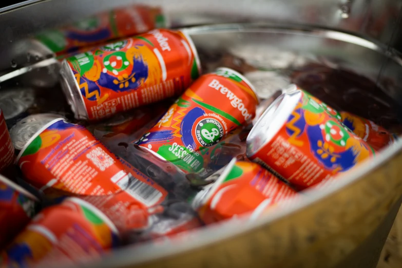 a bucket filled with canned and un - boiled drink