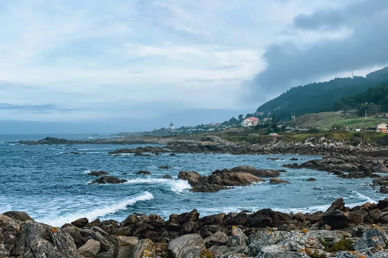 the water is blue and choppy at the edge of the shore