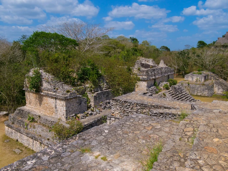 several ruins stand near one another on an open field