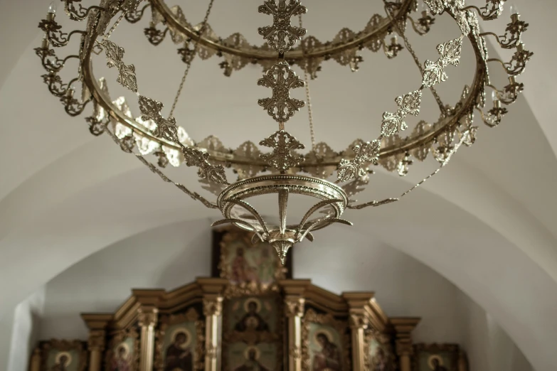 this fancy chandelier is above the alter