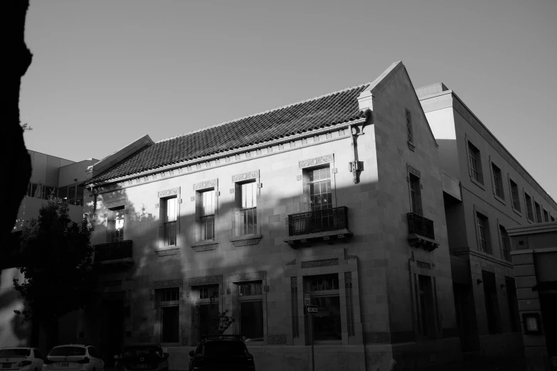 a tall building with a bunch of windows next to street