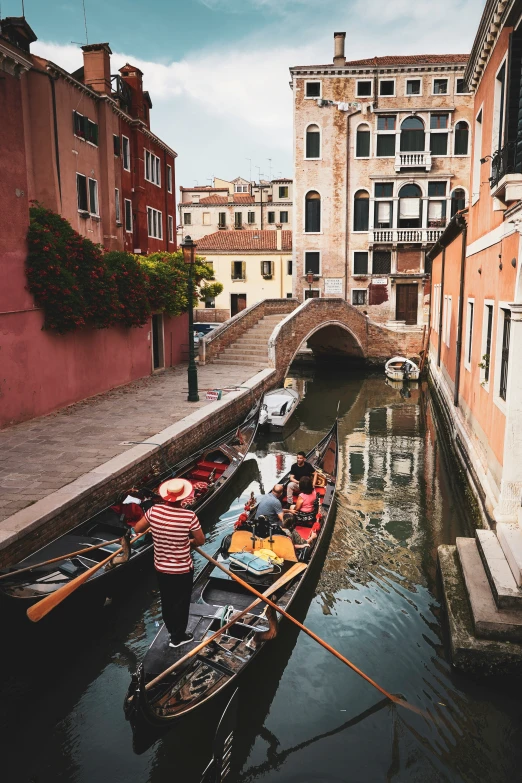 a rowboat is going down the canal