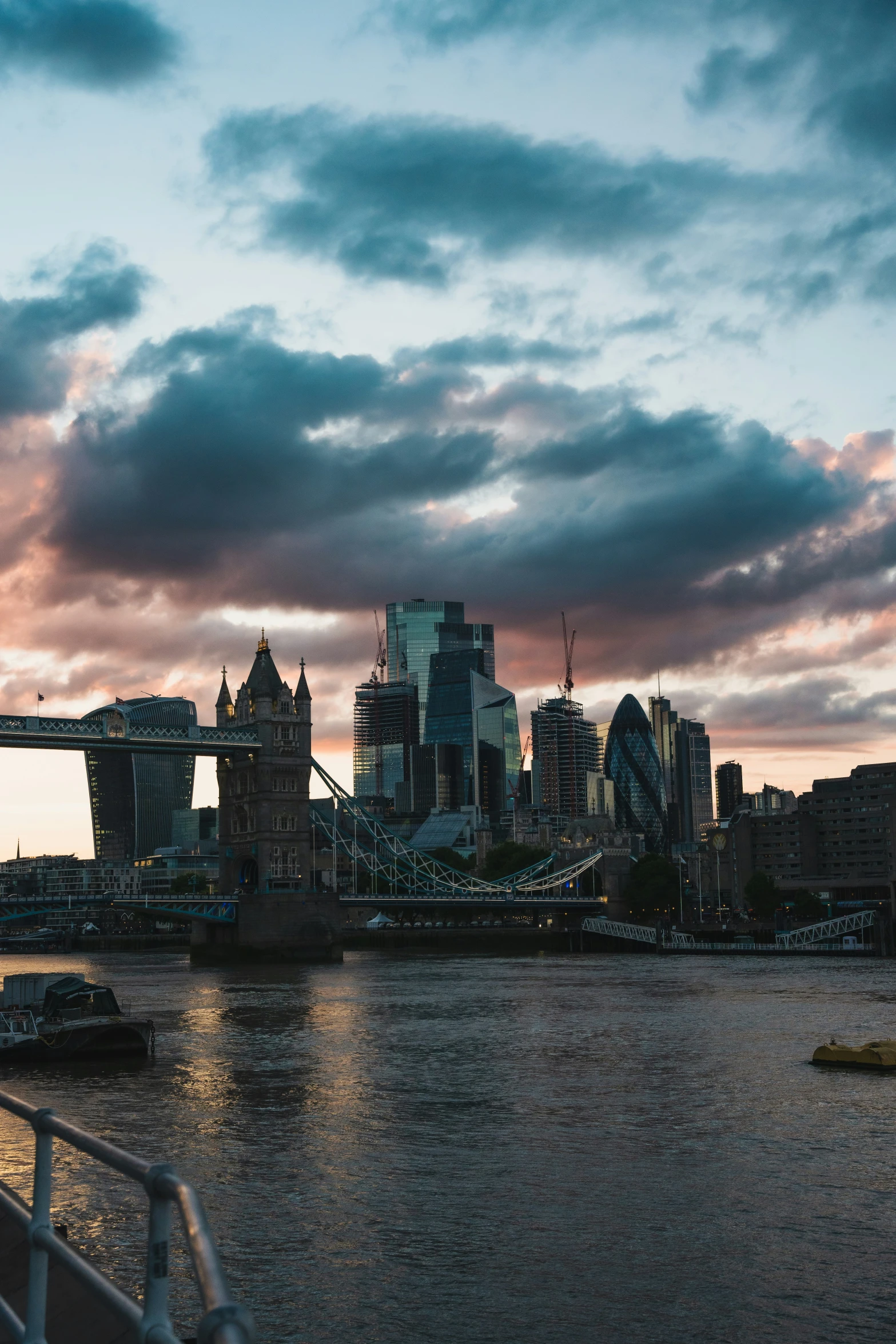 the clouds are changing colors over the city skyline