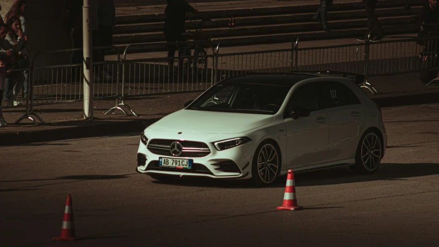 the mercedes benz c class is driving around a course