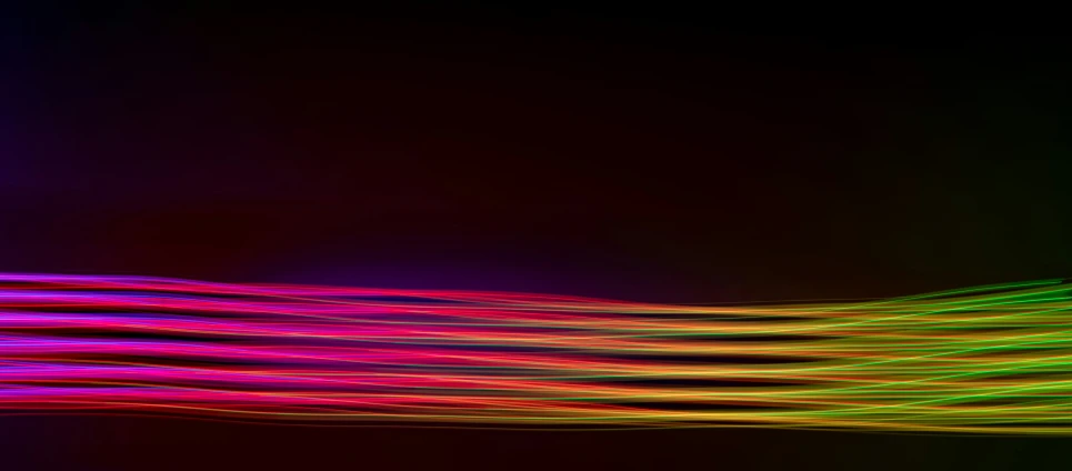 multicolored image of bright lines in dark area