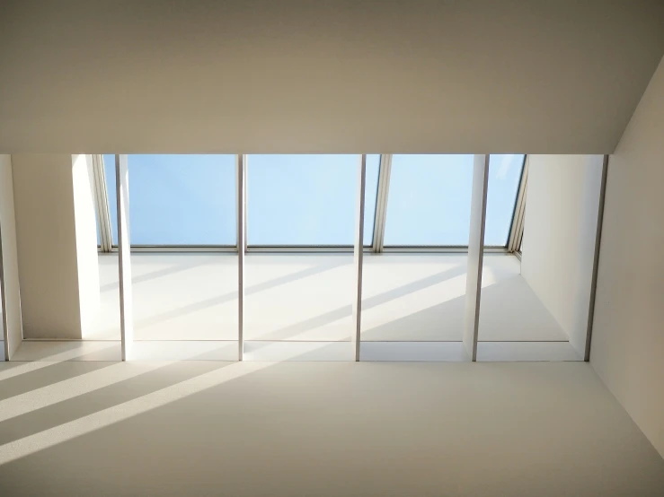 a room with white walls and a window