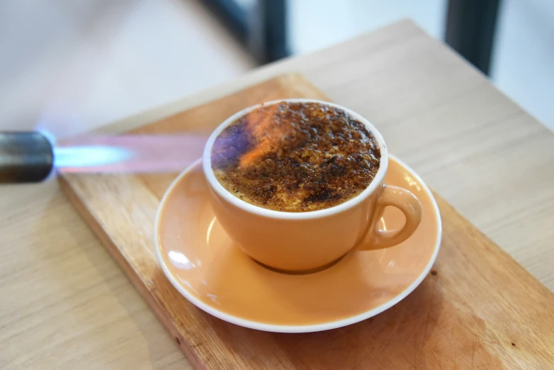 a bowl of food and a spoon on a saucer