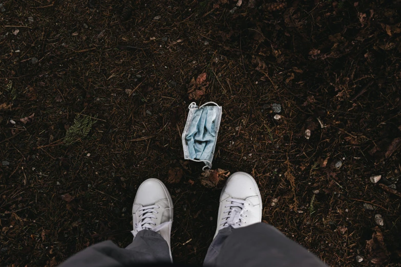 a pair of sneakers stands on the ground