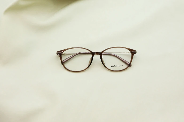 an image of a pair of eye glasses on white cloth