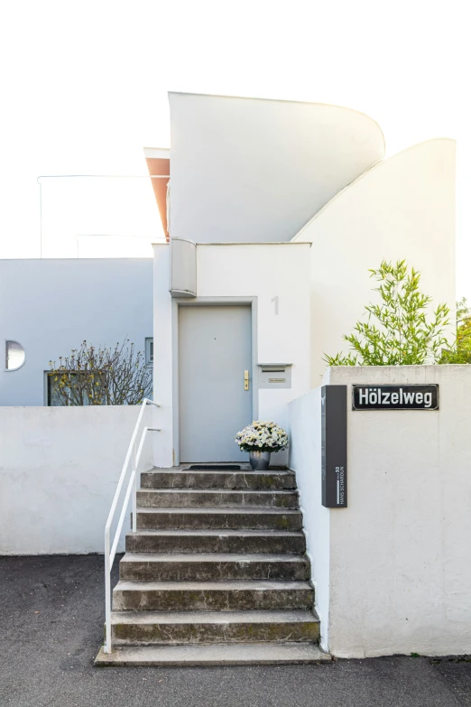 a pair of steps that lead to the entrance of a house