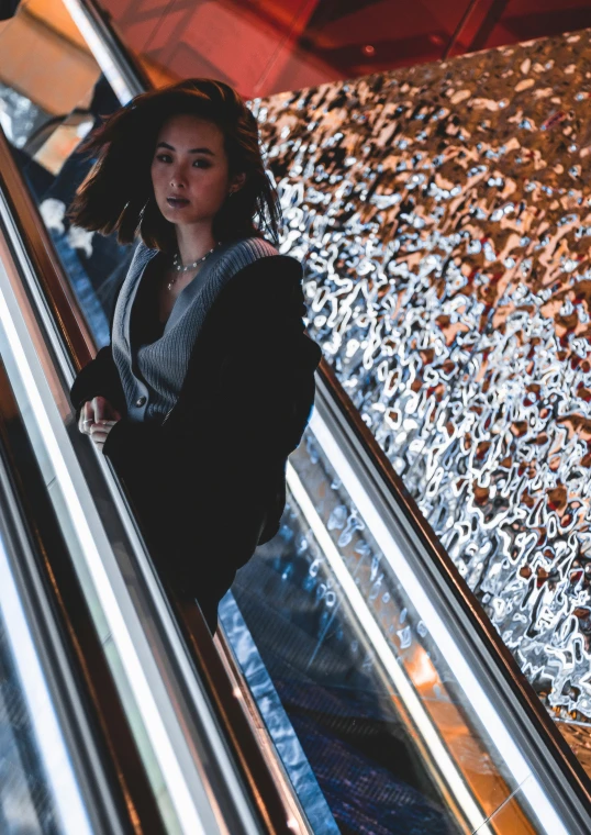 a woman on an escalator in an airport