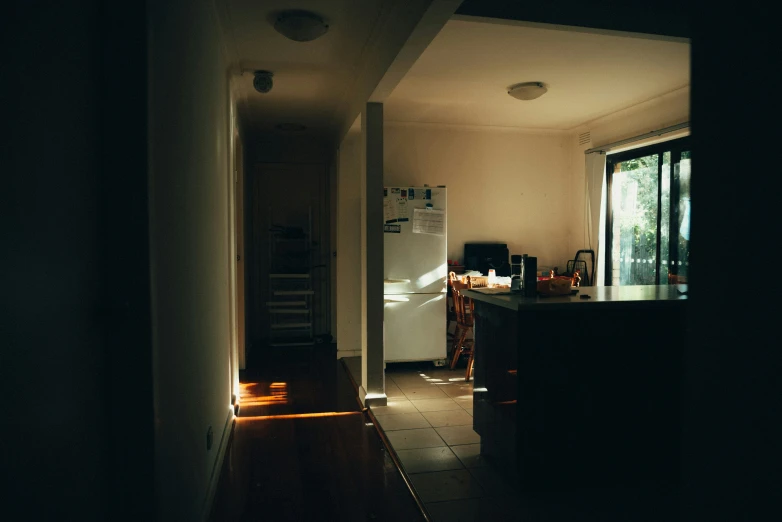 a kitchen that has a fridge in it