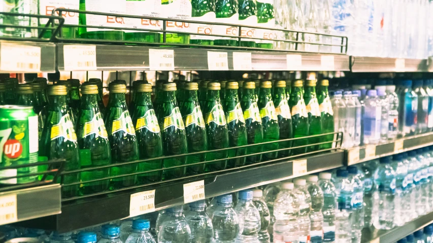 a large number of water bottles displayed in a store