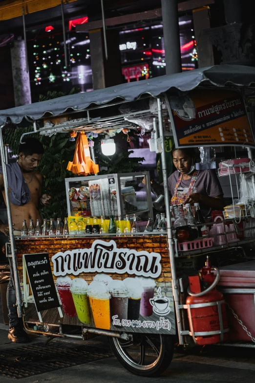 a small cart parked near the curb outside a store