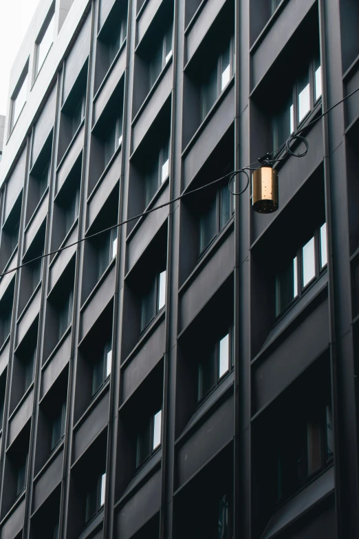 a very tall building with lots of windows next to it