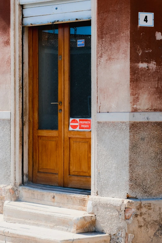 an entry way to a building with steps leading up to a door