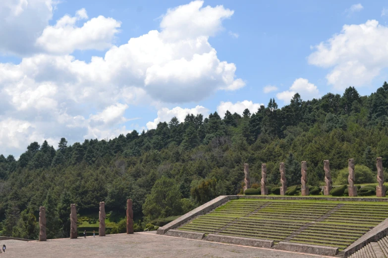 the outdoor seating area has many columns on it