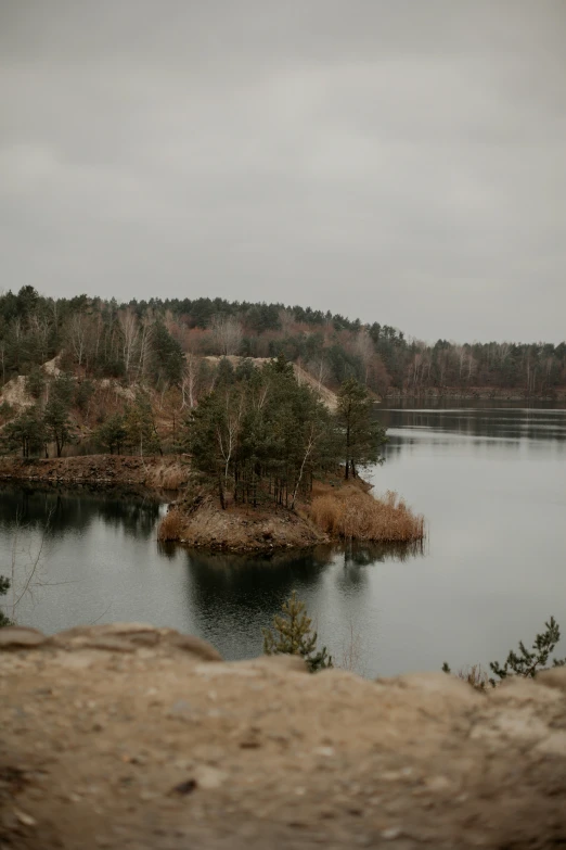 an island sits in the middle of a lake