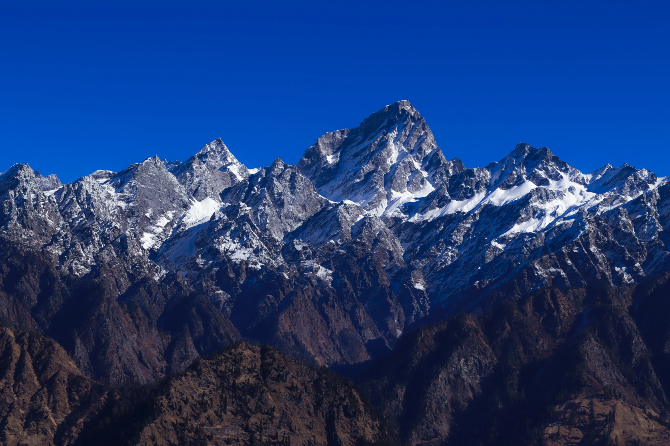 a mountain is shown with snow on the top